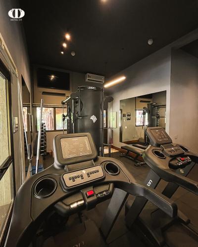 a gym with two treadmills and two machines at Hotel OT in Três Lagoas