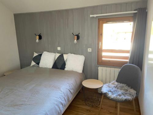 Ένα ή περισσότερα κρεβάτια σε δωμάτιο στο Appartement Parc Aux étoiles