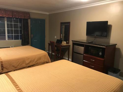 Ένα ή περισσότερα κρεβάτια σε δωμάτιο στο Circle City Inn
