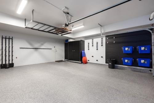 an empty room with a gym with blue baskets at Montebello by Whistler Premier in Whistler