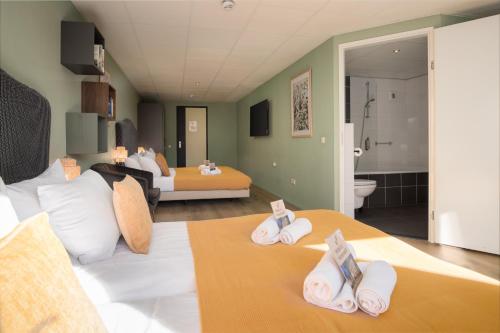 Hotel de Korenwolfにあるベッド