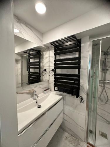 a bathroom with a sink and a mirror at Apartment Llavaneres I in Sant Andreu de Llavaneres