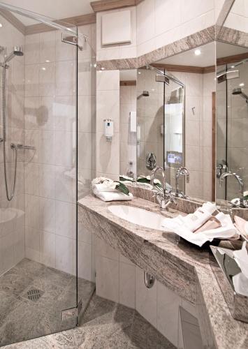a bathroom with a sink and a shower at Landhaus Wacker in Wenden