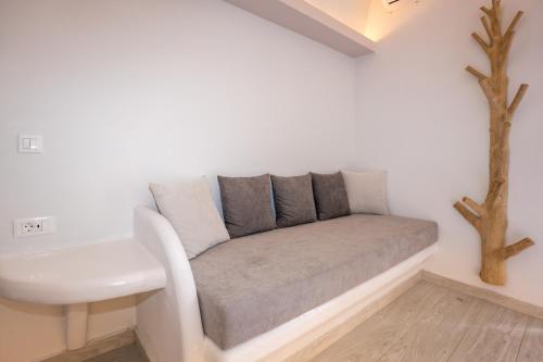a couch in the corner of a room at Zen Suites & Spa in Perissa