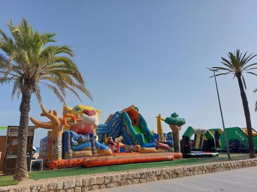 a water park with a large inflatable park at Cozy beach apartment in Calafell