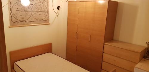 a closet with a wooden cabinet and a drawer at Oporto Spacious AP 4 bedroom in Pedrouços