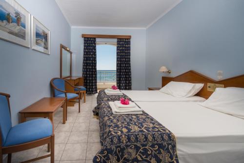 Postel nebo postele na pokoji v ubytování Astir Palace Hotel