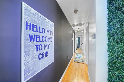 a hallway with a large poster on the wall at Comfort, Fun, & Charming - 5BR Oasis with Pool in Coatesville