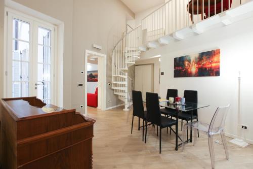 a dining room with a table and chairs at Carlo Alberto 46 in Pavia