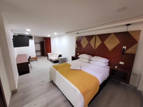 Postel nebo postele na pokoji v ubytování Hotel Victoria Regia Puerto Asís Putumayo