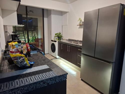 Kuchyň nebo kuchyňský kout v ubytování Casa condominio Ara