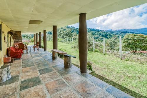 an outdoor patio with a view of the mountains at Casita El Sastre in Paso Macho