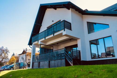 a house with balconies on the side of it at Pensiunea CityView in Câmpulung Moldovenesc
