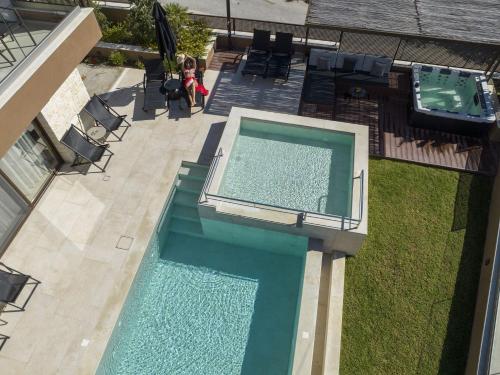 an overhead view of a swimming pool in a backyard at Almi-Cove Hilltop Villas in Almirida