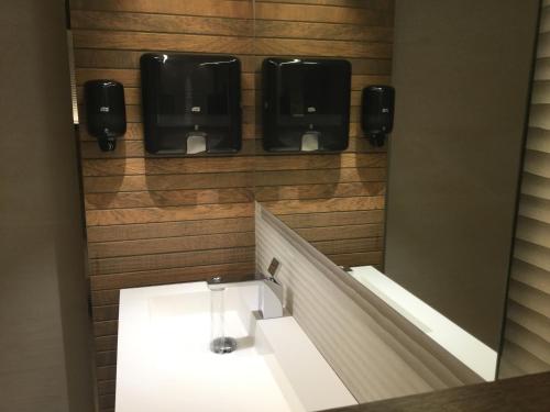 a bathroom with a mirror and a sink in a room at Montemar in Llanes