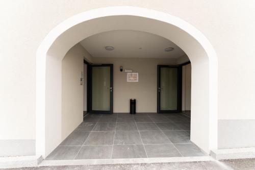 an empty corridor with doors in a building at Ranshofen Zimmervermietung Projektentwicklungs GmbH in Ranshofen