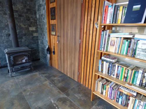 a room with two book shelves filled with books at Apartmány za Plotem in Jeseník