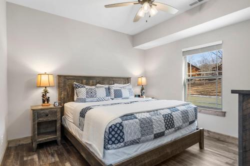 a bedroom with a bed and a window at Free Local Attraction Tickets-Private Hot Tub-Near Thunder Ridge and Table Rock-Cmty Pool in Hollister