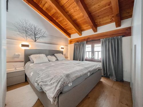 Ένα ή περισσότερα κρεβάτια σε δωμάτιο στο Suite Boisée - Maison Poluc trilocale