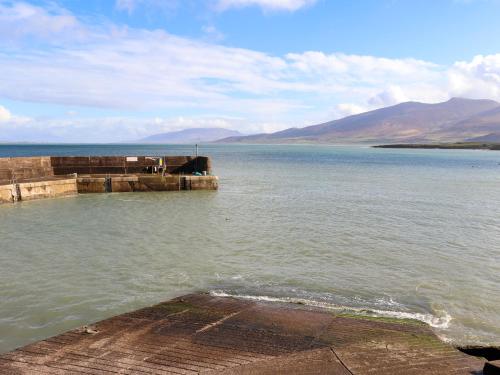 a view of a large body of water with a pier at Johnson's Cottage in Brandon