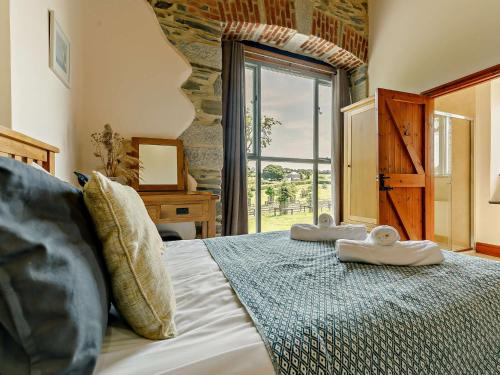 Ένα ή περισσότερα κρεβάτια σε δωμάτιο στο 2 Bed in Launceston 92552