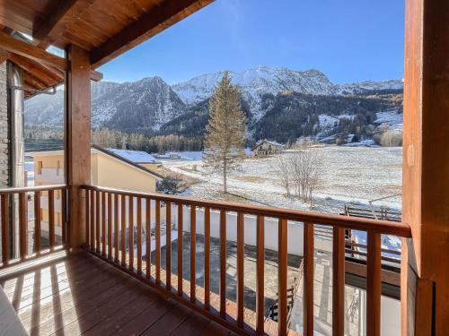 a view from the balcony of a cabin with snow covered mountains at Monte Zerbion Retreat - Poluc Apartments trilocale in Champoluc