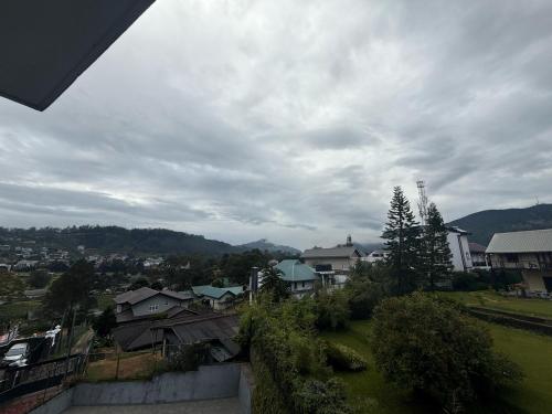 a view of a city with houses and trees at Nomentano Blue -Luxury Apartments- in Nuwara Eliya