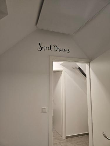 a sign that reads street dreams on the ceiling of a room at Apartma Zala in Brežice