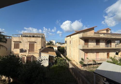 a view of an old building in a city at Semplice BnB Bonagia in Valderice