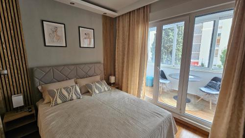 Ένα ή περισσότερα κρεβάτια σε δωμάτιο στο Luxury Apartment Lullu Residence