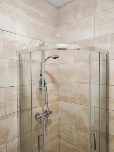 a shower with a glass door in a bathroom at En suite bedrooms, Heaton, Newcastle in Newcastle