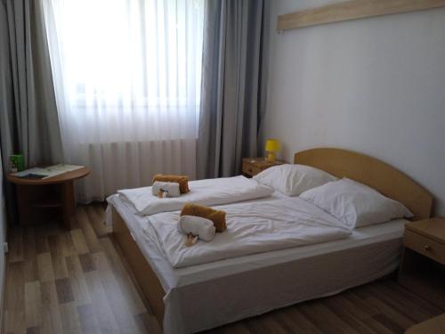 Postel nebo postele na pokoji v ubytování Hotel Miodowy