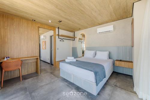 Giường trong phòng chung tại NWTs - Estúdios com Vista Lateral Mar em Maceió II