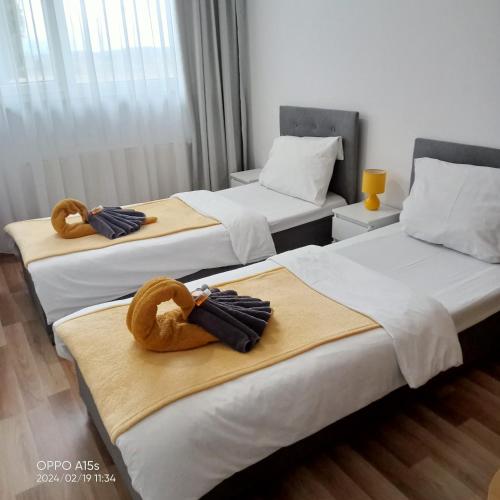Postel nebo postele na pokoji v ubytování Hotel Miodowy
