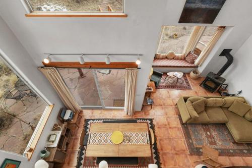 an overhead view of a living room with a couch and a table at Crestone Adobe Vista Manor in Crestone