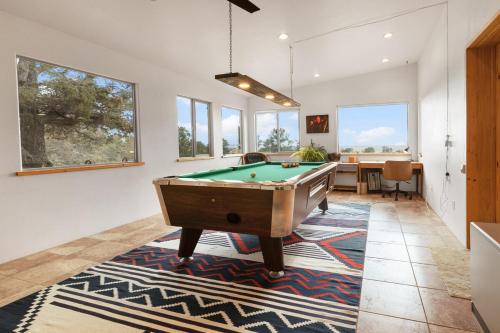 a living room with a pool table and a desk at Crestone Adobe Vista Manor in Crestone