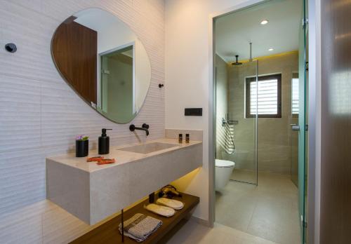 a bathroom with a sink and a mirror at Almi-Cove Hilltop Villas in Almirida