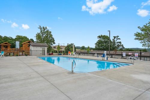 a swimming pool at a park with a playground at Moor Fun in Kimberling City