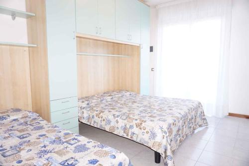 Ένα ή περισσότερα κρεβάτια σε δωμάτιο στο Apartment in Caorle 43163