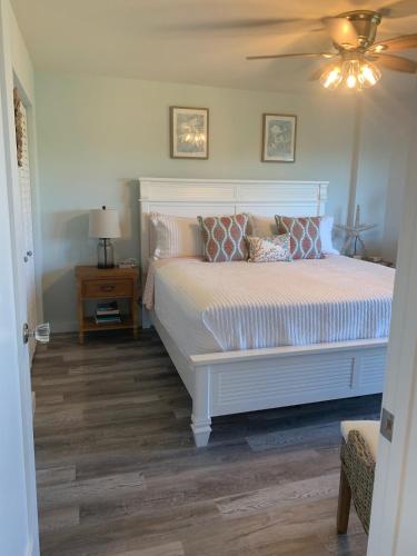 a bedroom with a bed and a ceiling fan at Ocean Pointe Resorts - Serenity 2308 in Tavernier