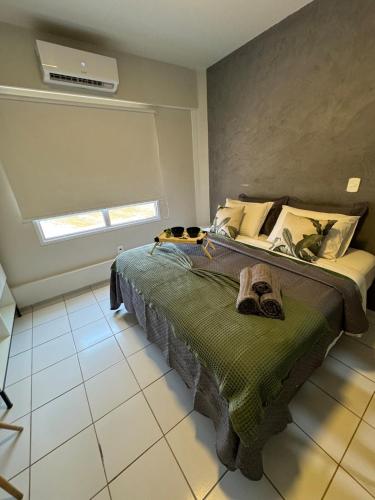 Ένα ή περισσότερα κρεβάτια σε δωμάτιο στο 906 Apartamento Gracioso!