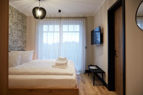 En eller flere senge i et værelse på Binnendiek Haus 4 Apartment 5