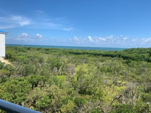 a view of the ocean from the balcony of a house at Ocean Pointe Resorts - Serenity 2308 in Tavernier