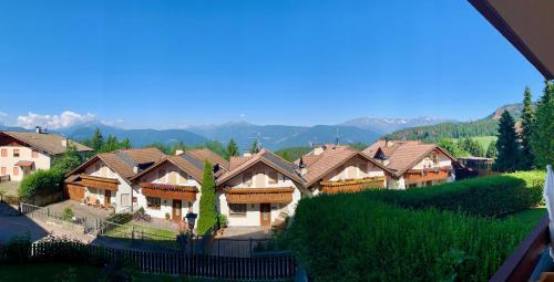 a group of houses with mountains in the background at Apartment in South Tyrol with a beautiful panoramic view in Verano