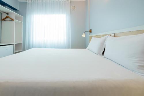 Ένα ή περισσότερα κρεβάτια σε δωμάτιο στο ibis Styles Manaus