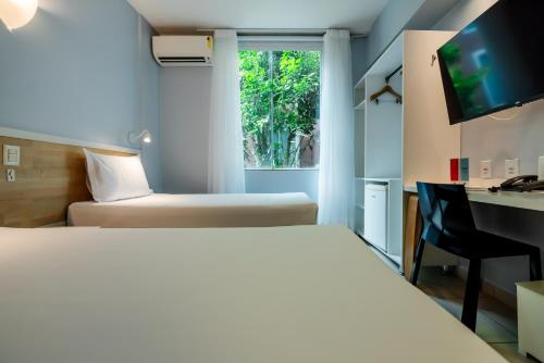 Postel nebo postele na pokoji v ubytování ibis Styles Manaus