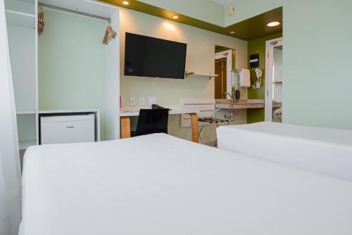 Ένα ή περισσότερα κρεβάτια σε δωμάτιο στο ibis Styles Manaus