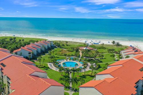 an aerial view of a resort and the beach at Modern beachfront condo in Sarasota