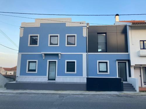 a blue building on the side of a street at Casa Azul in Costa Nova