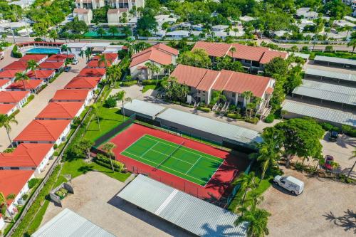 an overhead view of a tennis court in front of houses at Modern beachfront condo in Sarasota